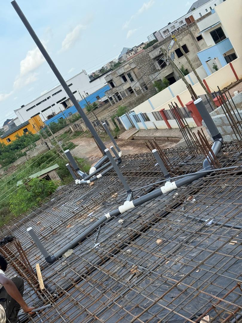 Drainage waste pipes laid on first-floor slab reinforcement
