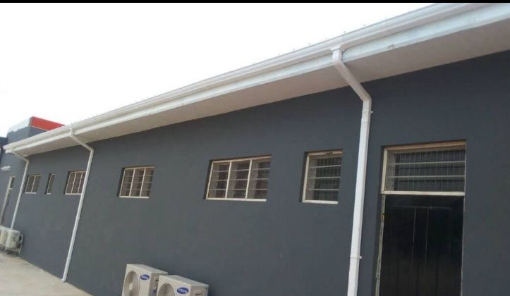 Rain gutter system installation by Holiness Plumbing & Construction