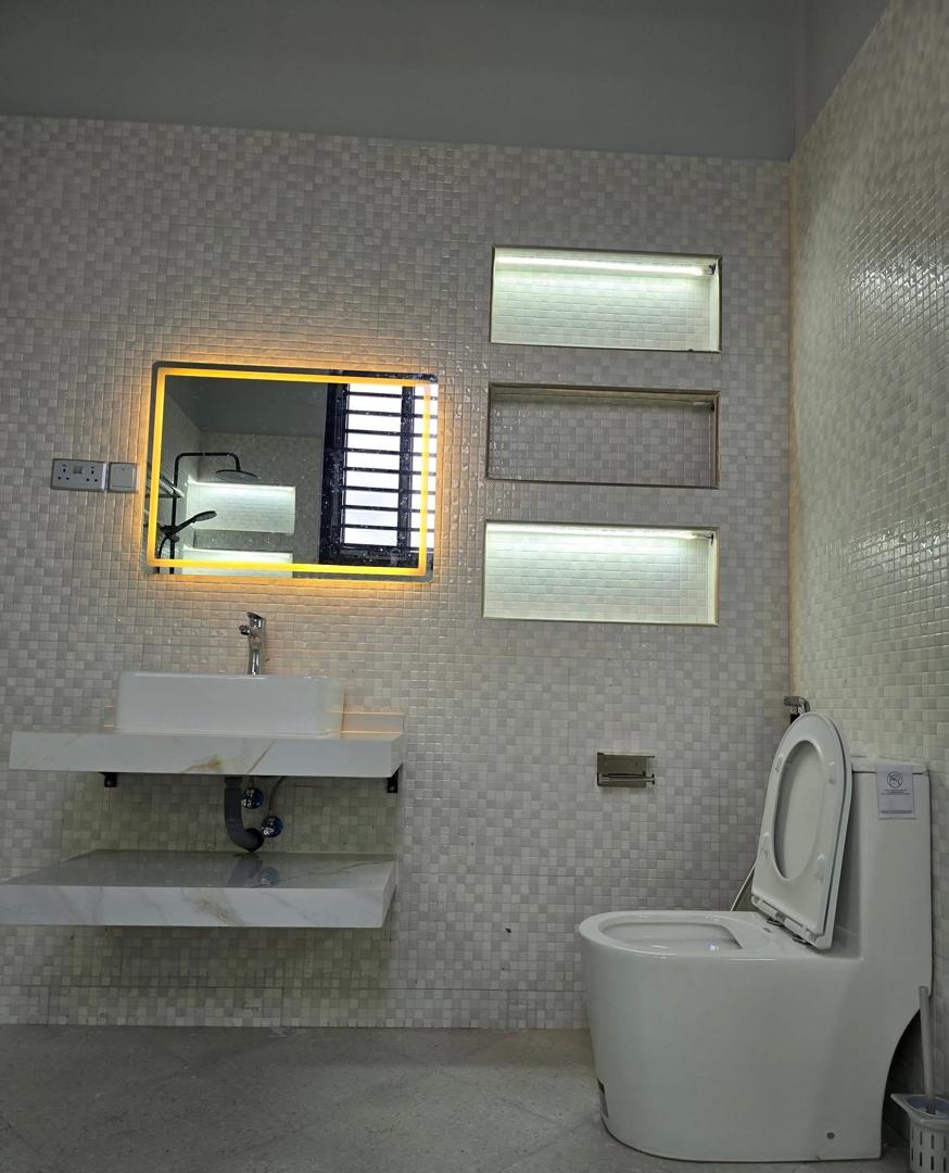 LED mirror and floating vanity bathroom installation by Holiness Plumbing & Construction